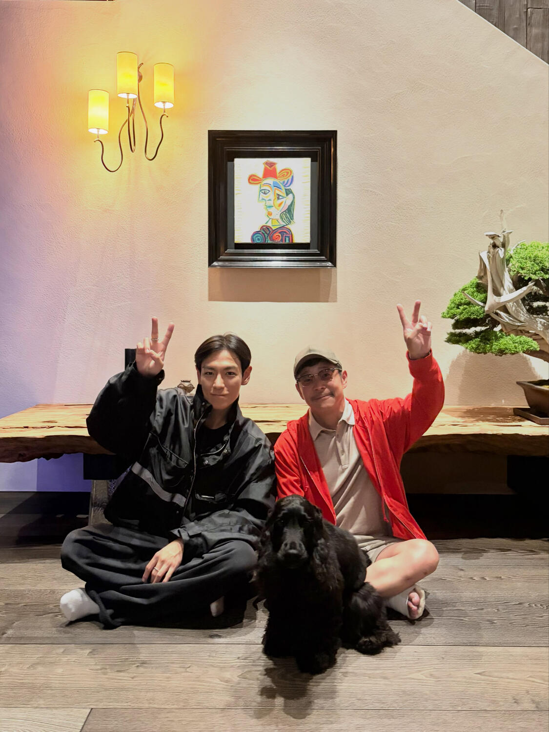 T.O.P with his friend Yuzaku Maezawa and his dog Rikyu.