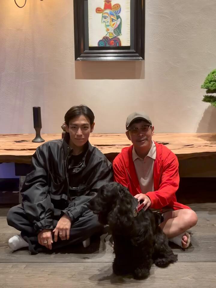 T.O.P and his friend Yuzaku Maezawa with his dog Rikyu.